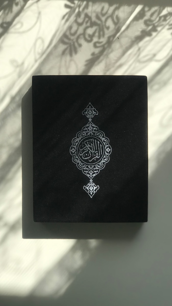 A black book with a white design on it