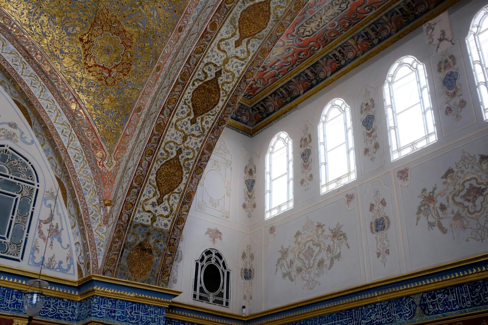 Capture of a beautifully detailed mosque interior featuring intricate Islamic art and architecture.
