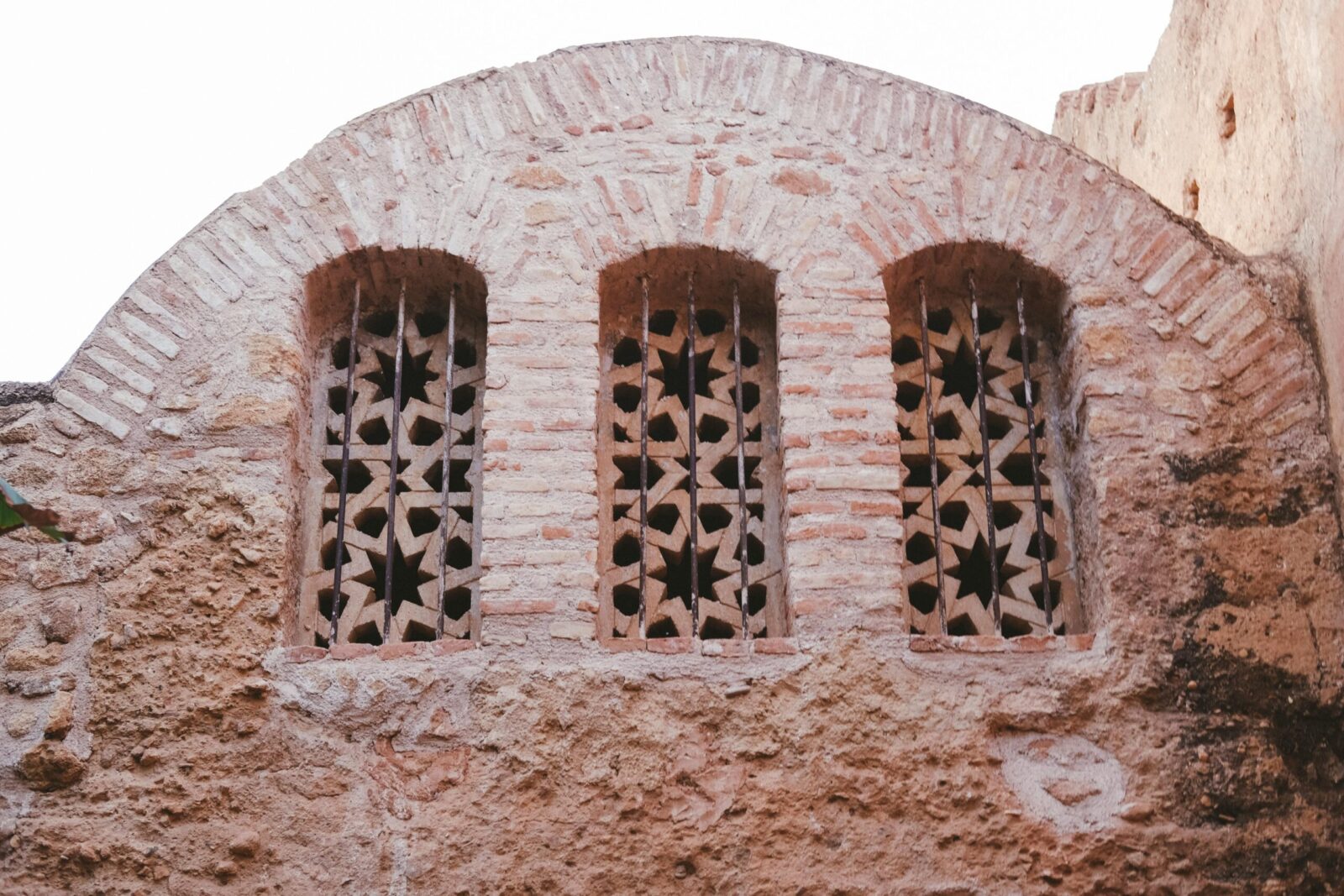 Historical window architecture in Rabat, Morocco with intricate star patterns.