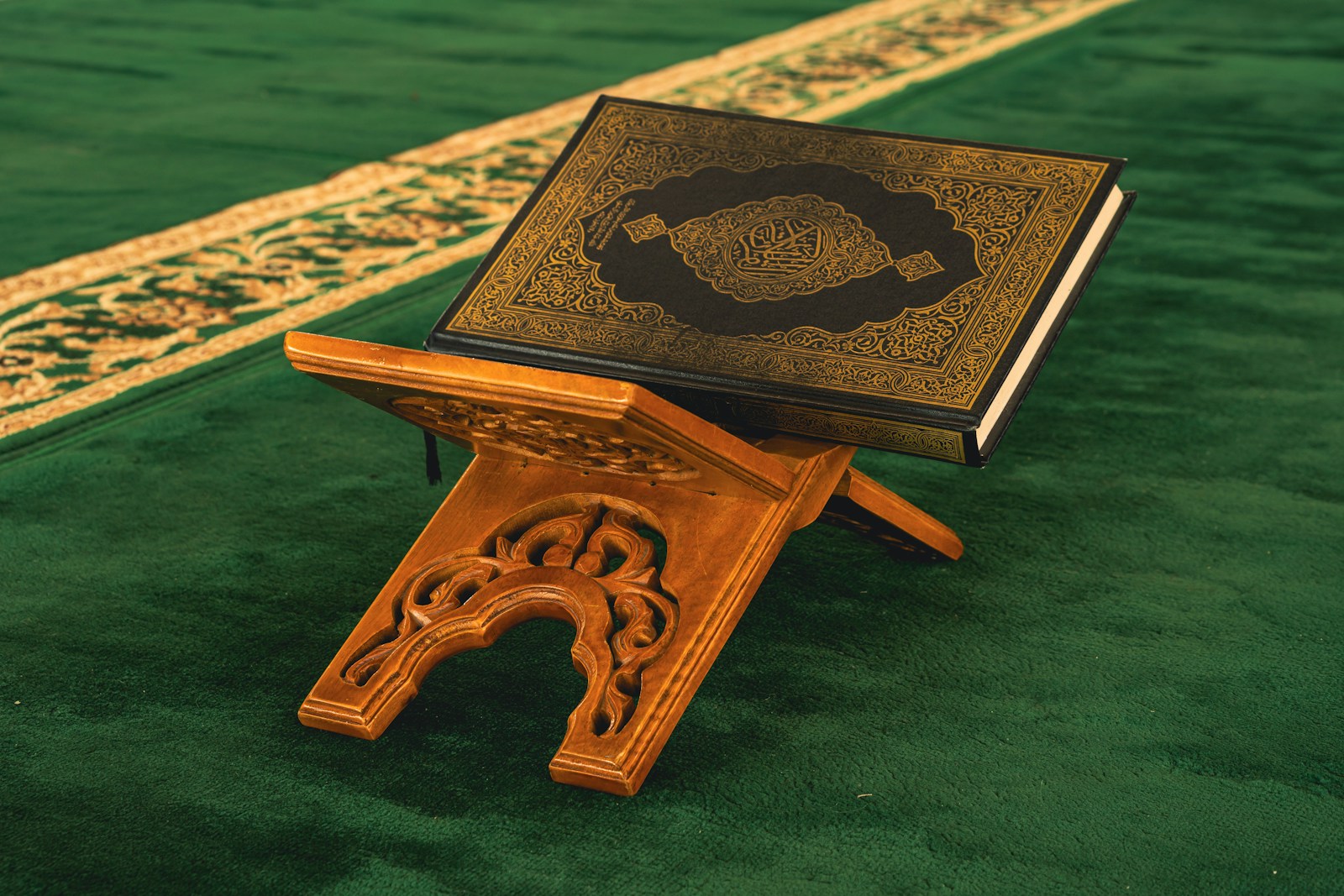 A small wooden stand with a book on top of it