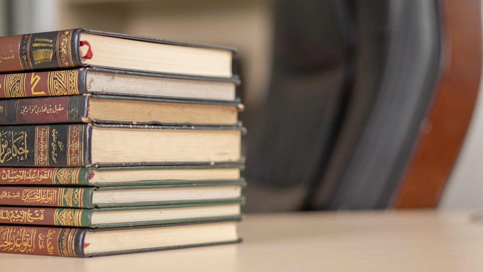 a stack of books sitting on top of a table